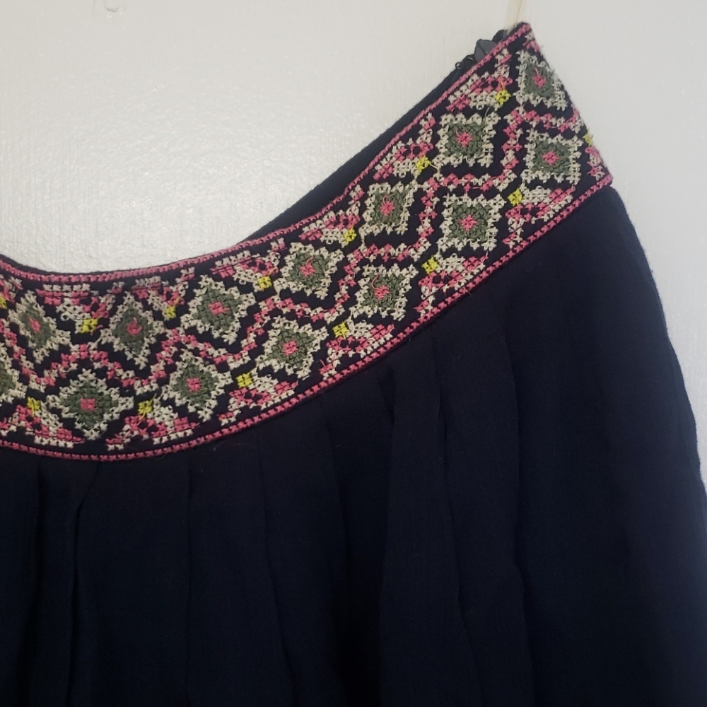 Adorable flirty, partially pleated mini skirt